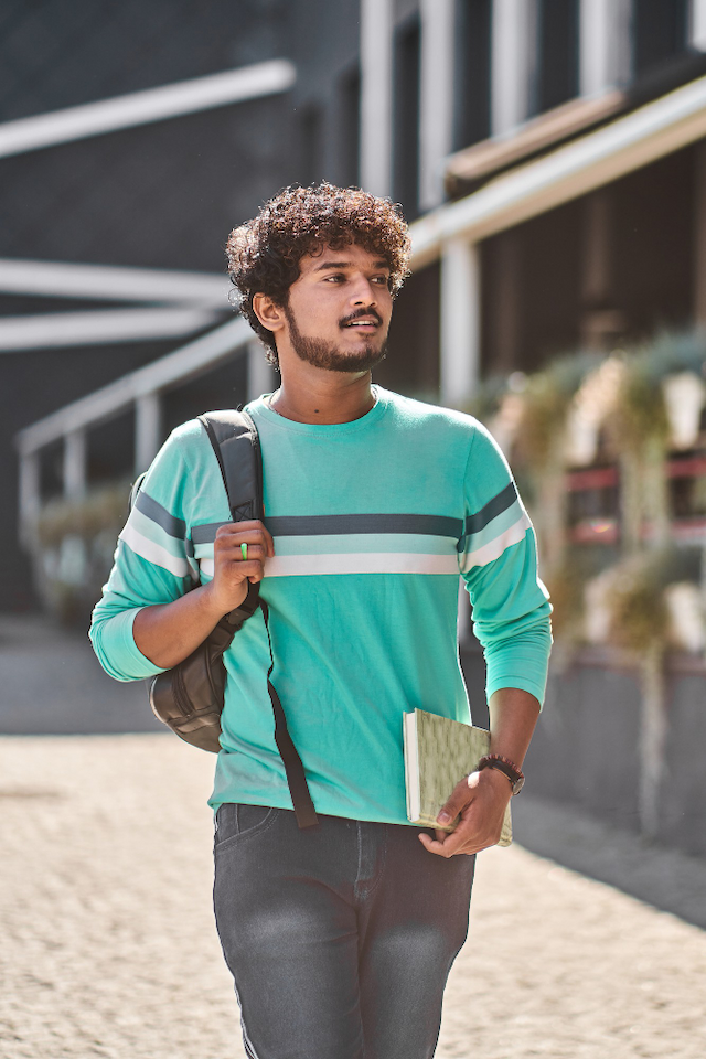 Student in green striped shirt